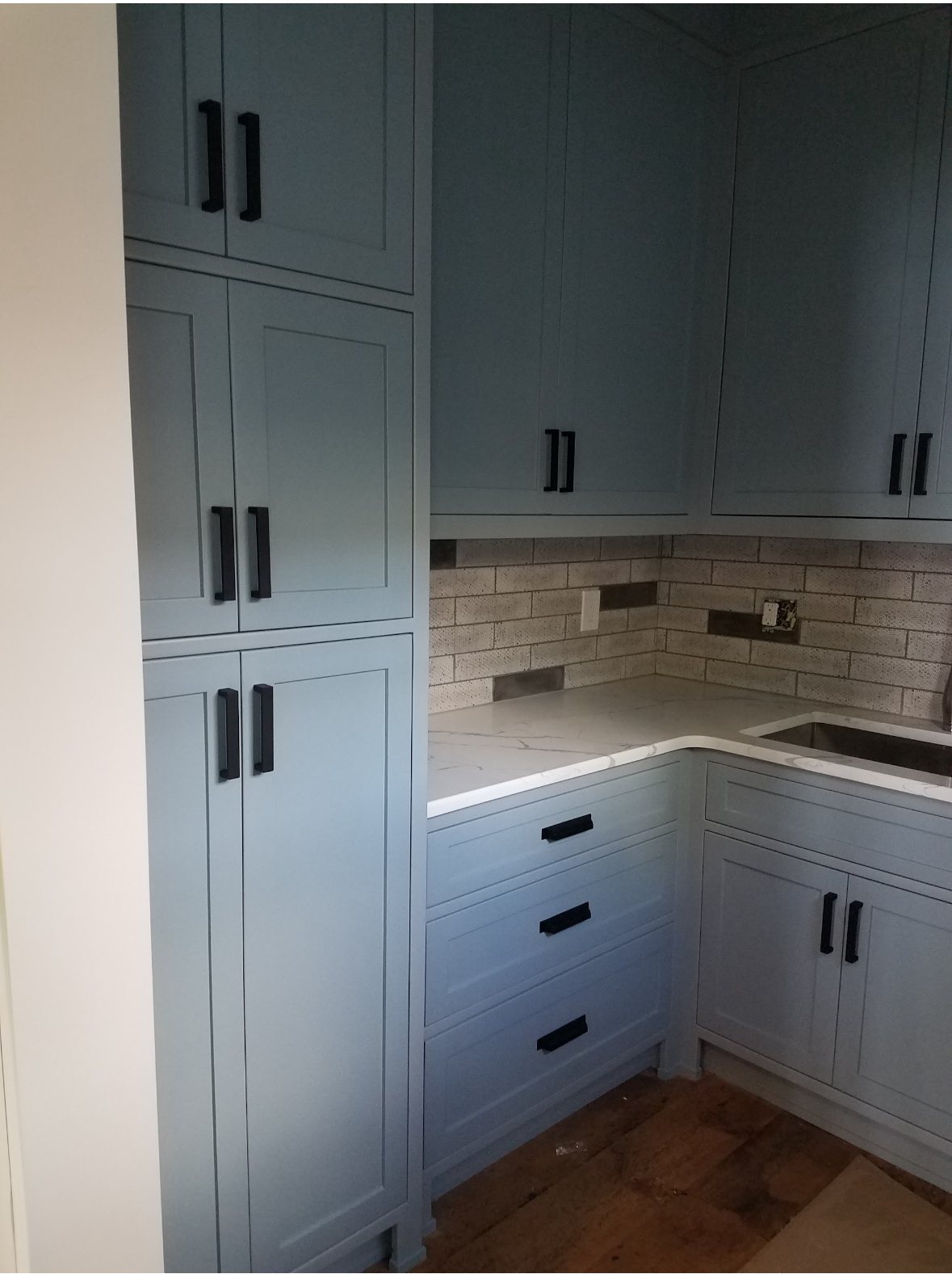 Custom blue-gray shaker cabinetry